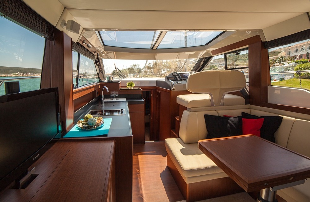 luxury yacht windows surrounding a boat galley